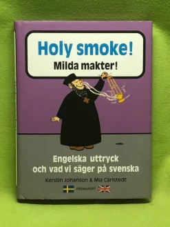 Shop Holy smoke! = Milda makter! : engelska uttryck och vad vi säger på svenska / J Encyklopædier & Leksikon